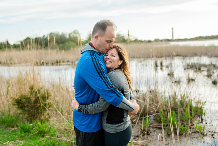 A man kisses his fiance in cape may.